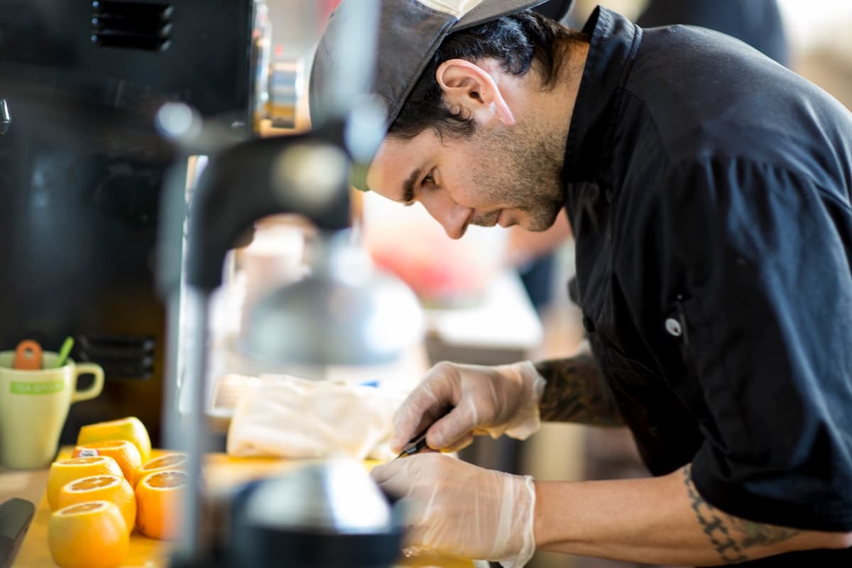 Chef prepping ingredients in a professional kitchen