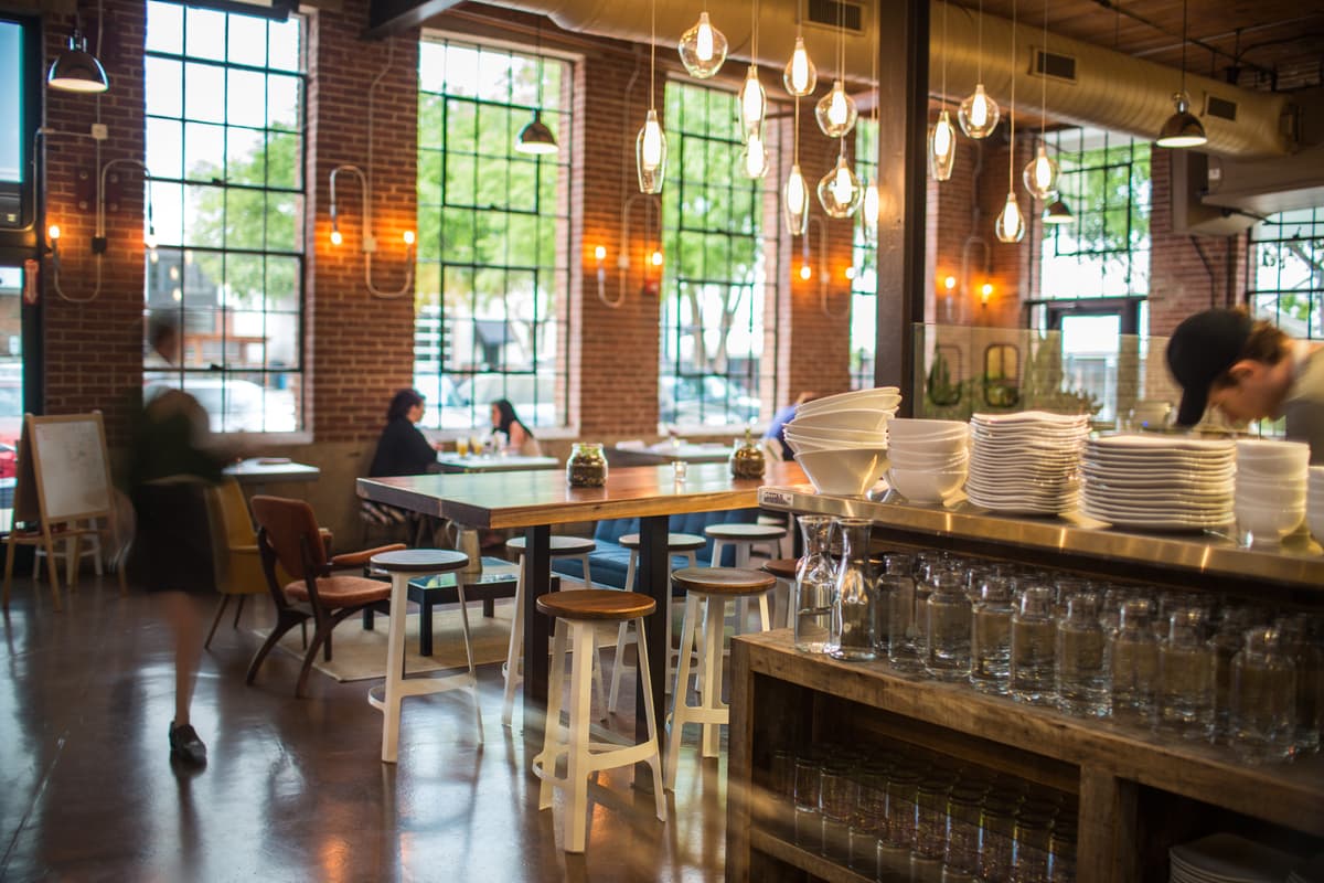Restaurant kitchen scene showing chefs working with fresh ingredients